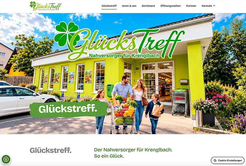 Startseite von glückstreff.at mit dem Geschäft in Gelbgrün und einer einkaufenden Familie